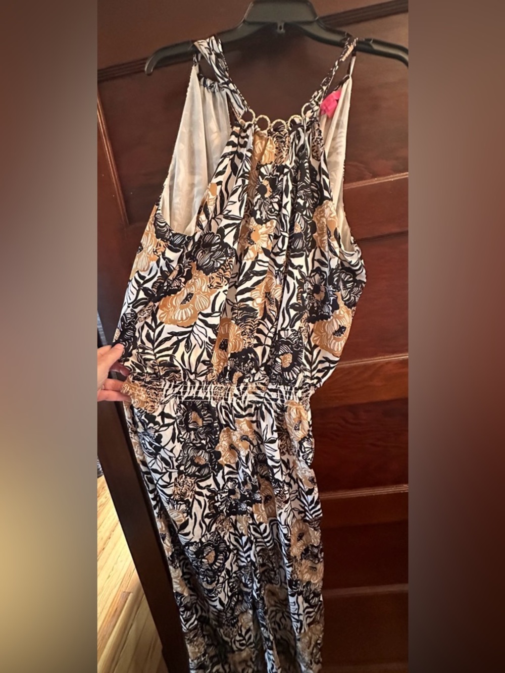 Lilly Pulitzer Black, white, Gold Floral Sleeveless jumpsuit has tear in back